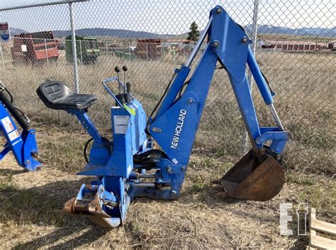 new holland skid steer attachments used|new holland boomer backhoe attachment.